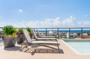 Beautiful Studio with kitchen AC Gym Pool Ocean View from the rooftop